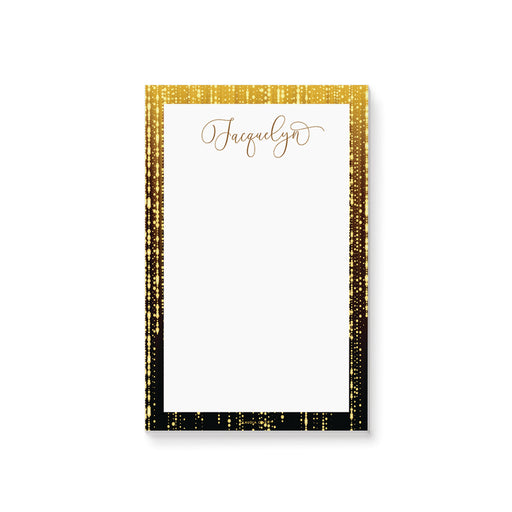 Personalized notepad with black border, sparkling light accents, and custom name in elegant script