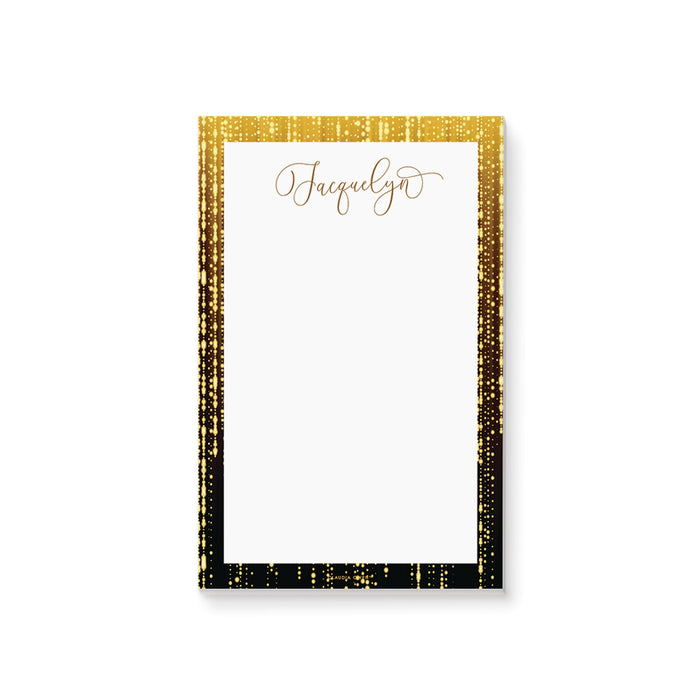 Personalized notepad with black border, sparkling light accents, and custom name in elegant script