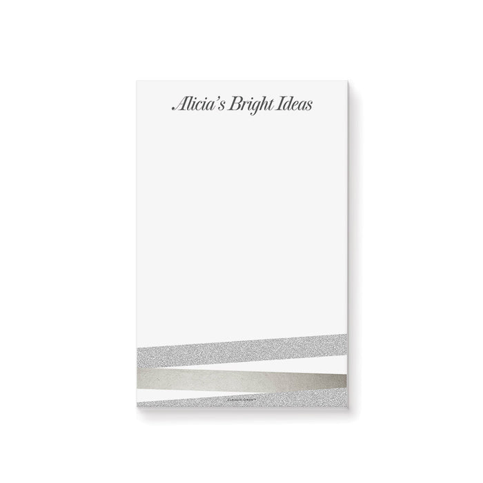 Personalized notepad with custom name, elegant neutral tones, and modern stripe design on a clean white writing pad.