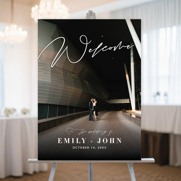 Modern wedding welcome sign featuring a photo of the couple, their names, and the date.