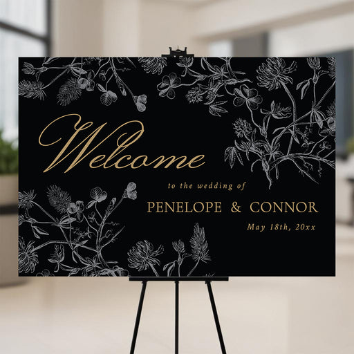 Black and gold botanical wedding welcome sign with vintage floral foliage, elegant entrance décor