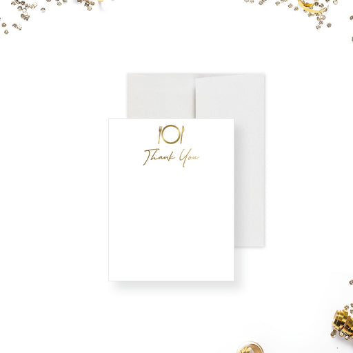 A white thank you card with elegant typography and gold accents, displayed with an envelope, against a scattered confetti background suggesting celebration.