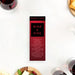 Wine and dine ticket invitation with a red design reminiscent of a full-bodied wine, featuring customized event details, ideal for dinner parties and wine events.