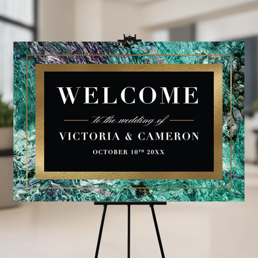 Emerald green marble wedding welcome sign personalized with the couple's names for an elegant ceremony entrance display.
