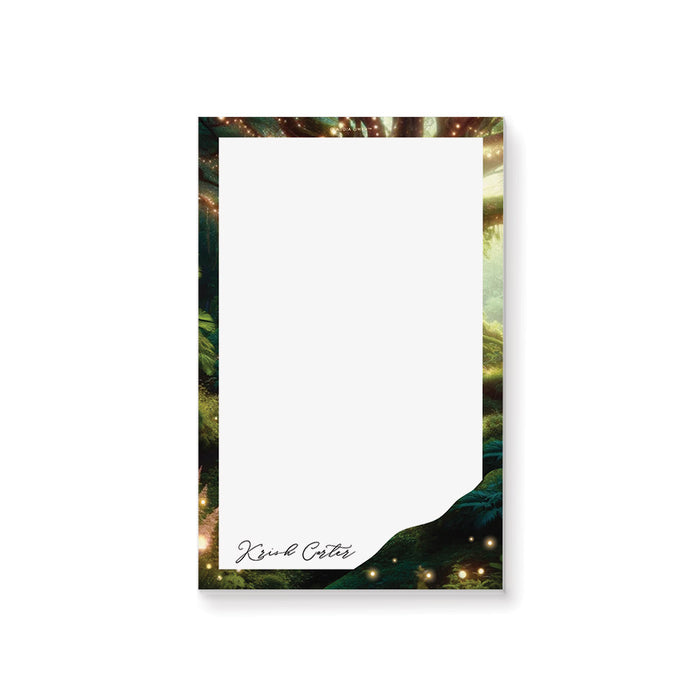 Personalized enchanted forest notepad with magical greenery border, glowing lights, and custom name