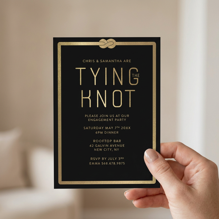 Engagement invitation held in hand