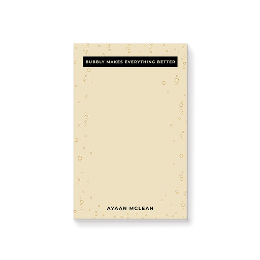 Elegant champagne bubble notepad featuring “Bubbly Makes Everything Better” and a personalized name. Chic stationery for champagne enthusiasts.