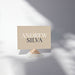 a name card with the name 'ANDREW SILVA' printed on it, placed on a stand.