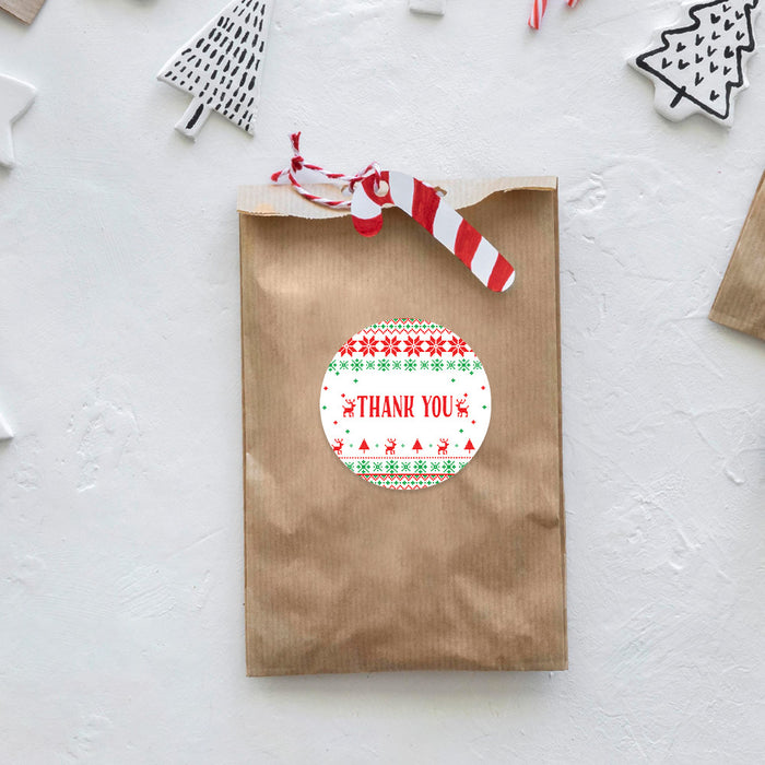 Brown paper bag with a festive 'Thank You' sticker on a light gray background