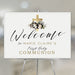 Personalized First Holy Communion welcome sign featuring a gold cross and floral design. Custom name and event décor for church or reception.