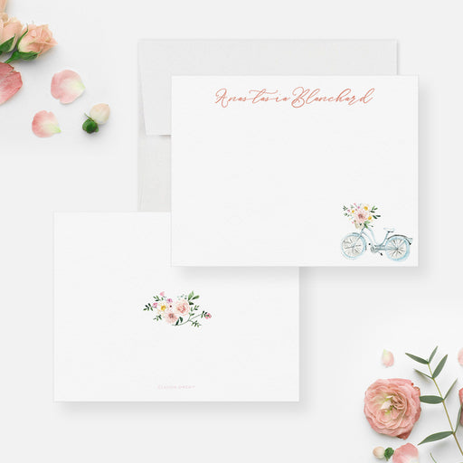 Personalized bicycle note card front and back with a blue bicycle, basket of flowers and a matching floral bouquet.