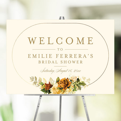 Floral bridal shower welcome sign featuring a vintage flower arrangement in an elegant gold frame