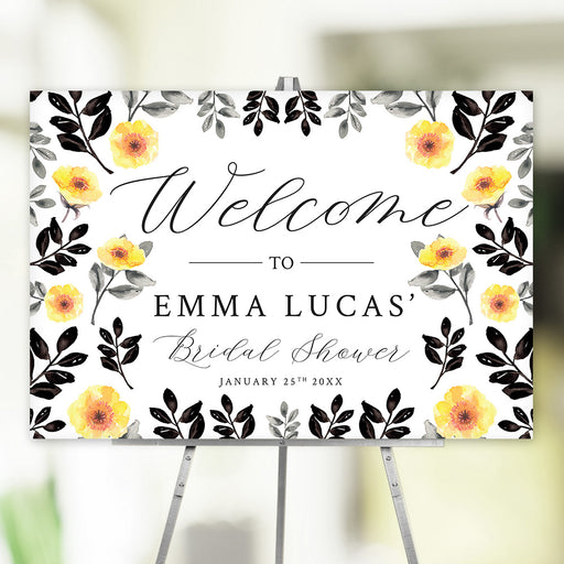 Floral bridal shower welcome sign with custom name and date, decorated with watercolor flowers and black foliage.