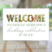 Personalized floral birthday welcome sign featuring vibrant flower-filled "WELCOME" text and green script accents. 