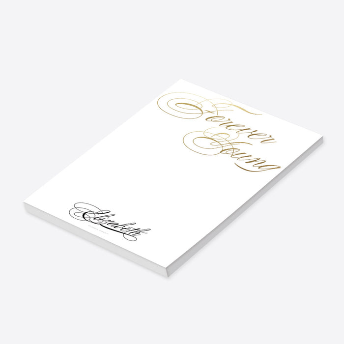 personalized Forever Young birthday notepad with elegant gold-style script lettering and custom name-side
