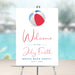 Fourth of July beach bash welcome sign with red, white, and blue beach ball design