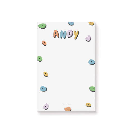 Personalized kids notepad with colorful rock climbing hold design on black background