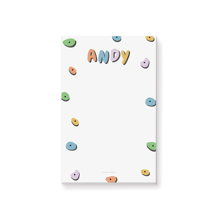 Personalized kids notepad with colorful rock climbing hold design on black background
