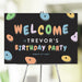 Rock climbing birthday party welcome sign with colorful climbing hold illustration