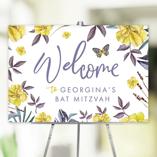 Yellow floral Bat Mitzvah welcome sign featuring a butterfly, purple leaves, and customizable text.
