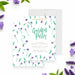 Garden party birthday invitation featuring watercolor purple flowers, green leaves, and elegant script lettering-front-back