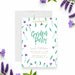 Garden party birthday invitation featuring watercolor purple flowers, green leaves, and elegant script lettering-front