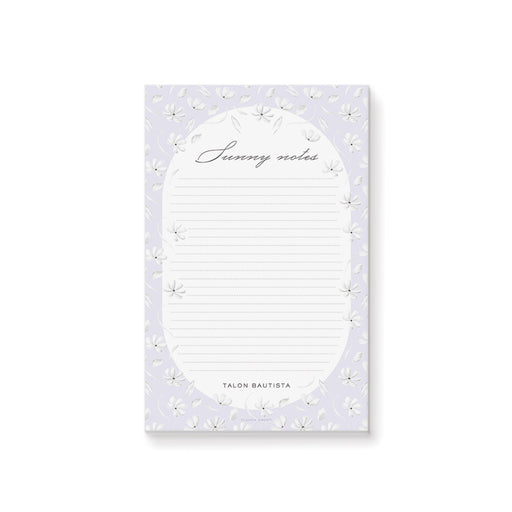 Personalized floral notepad with lavender background, white flowers, dotted writing lines, "Sunny notes" text, and custom name