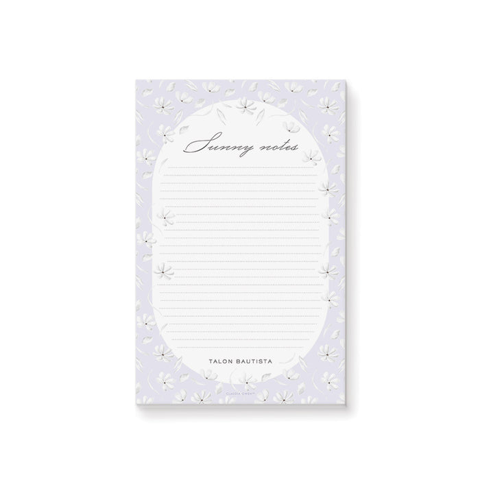 Personalized floral notepad with lavender background, white flowers, dotted writing lines, "Sunny notes" text, and custom name