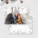 Modern holiday photo card featuring a smiling couple in winter attire surrounded by silver glitter accents and “Happy Holidays” text.