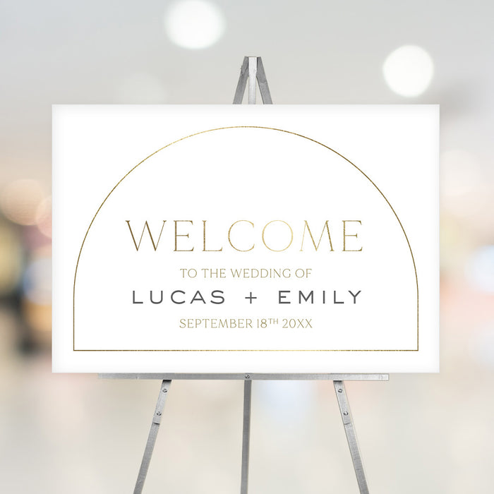 Minimalist gold arch wedding welcome sign with customizable names and date, personalized decor for ceremony or reception entrance.