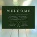 Green and gold golf-themed corporate welcome sign featuring golf clubs, serving as an event entrance sign for professional gatherings.