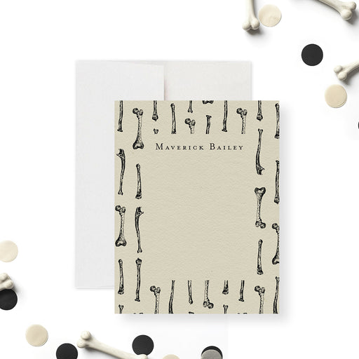 Personalized gothic note card featuring a skeleton bone illustration, perfect for spooky birthday favors or distinctive Halloween thank-you gifts.-front