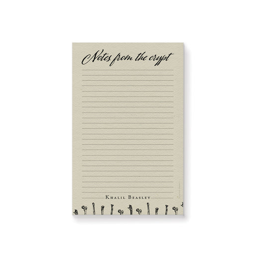 Personalized gothic notepad featuring “Notes from the Crypt” title and bone design, perfect spooky stationery gift.