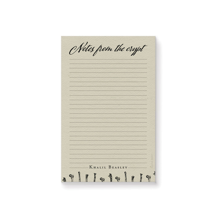 Personalized gothic notepad featuring “Notes from the Crypt” title and bone design, perfect spooky stationery gift.