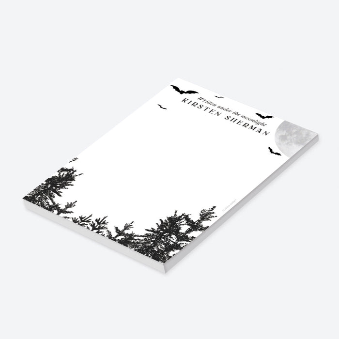 Personalized notepad with "Written under the moonlight" text, full moon and flying bats, and dark forest silhouette for notes, lists, and gifts-side