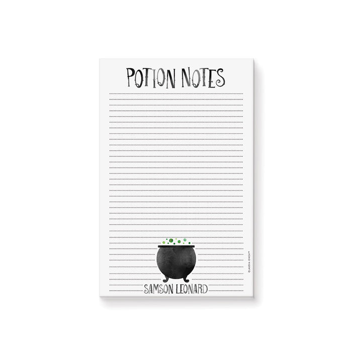 Halloween notepad with a witch-themed design featuring a black cauldron and bubbling green bubbles, perfect for spooky season gifts.