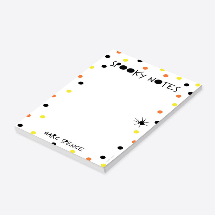 Halloween notepad featuring “Spooky Notes” text, with orange, black, and yellow dots, and a spider illustration.-side
