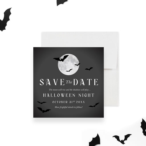Halloween save the date card with a glowing full moon, flying bat silhouettes, and bold white text on a dark charcoal background-front