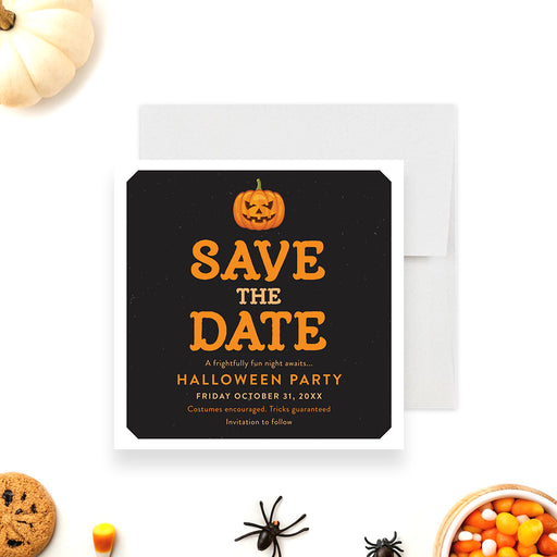Black Halloween save the date card with an orange jack-o'-lantern illustration and bold orange text-front
