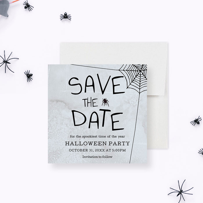 Halloween save the date card with spooky spider web design, gray textured background, and black spider illustrations-front