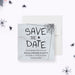 Halloween save the date card with spooky spider web design, gray textured background, and black spider illustrations-front
