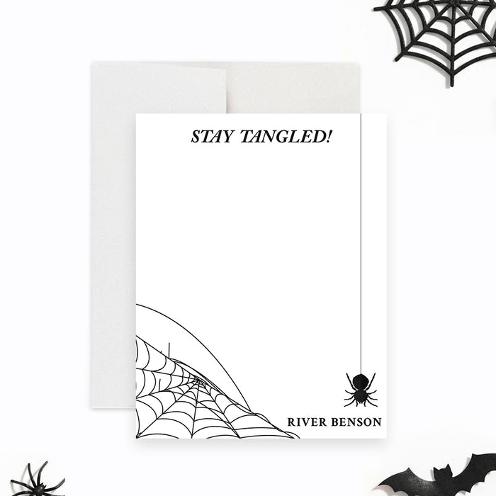 Personalized Halloween thank you card featuring a minimalist spider web design with a hanging spider on a clean white background-front