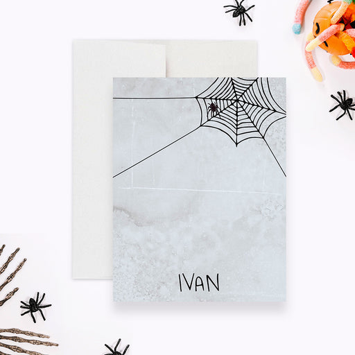 personalized Halloween thank you card with a spooky spider web design, hanging spider, and custom name-front