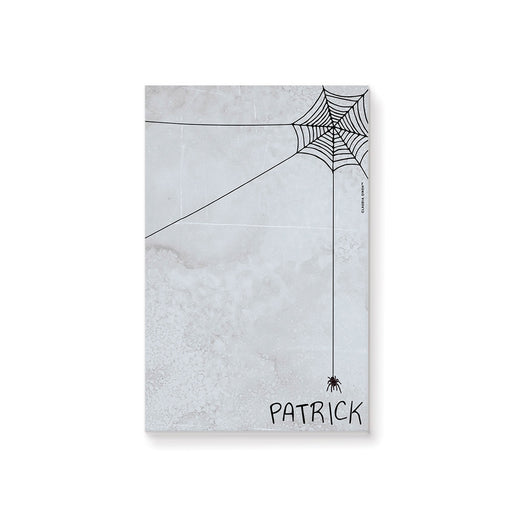 personalized Halloween notepad with spooky spider web design, gray textured background, hanging spider, and custom name