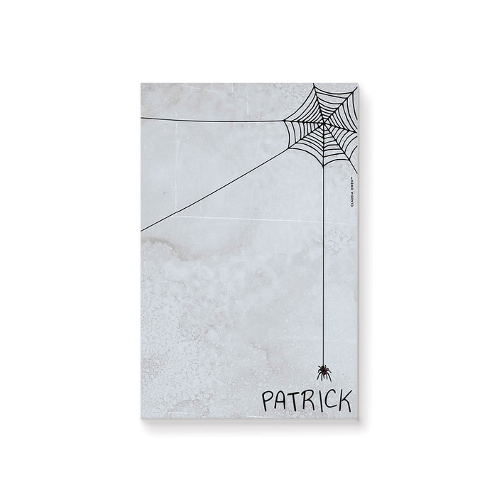 personalized Halloween notepad with spooky spider web design, gray textured background, hanging spider, and custom name