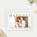 Happiest Holidays Christmas photo card template with gold lettering, a family photo and a white background.