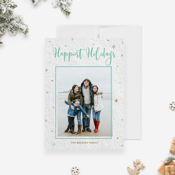 Editable “Happiest Holidays” digital photo card featuring a modern minimalist design with gold and teal accents, customizable family Christmas greeting.