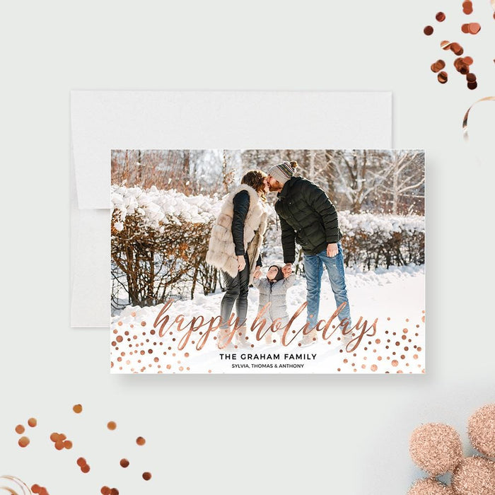 Happy Holidays photo greeting card featuring a winter theme, modern typography and a customizable family photo layout in a printable digital format