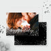 Front and back of the Happy Holidays photo card template, showing a photo front and a black back with snow dots.