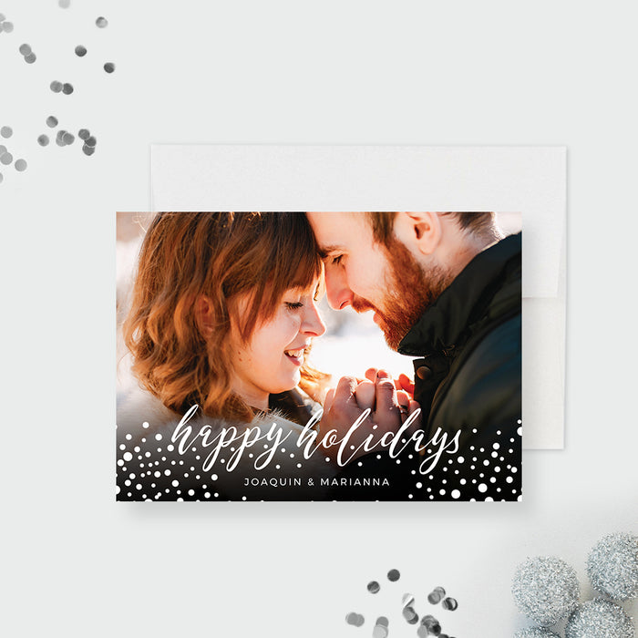Happy Holidays photo card template with a couple's photo, white script lettering and scattered snow dots.
